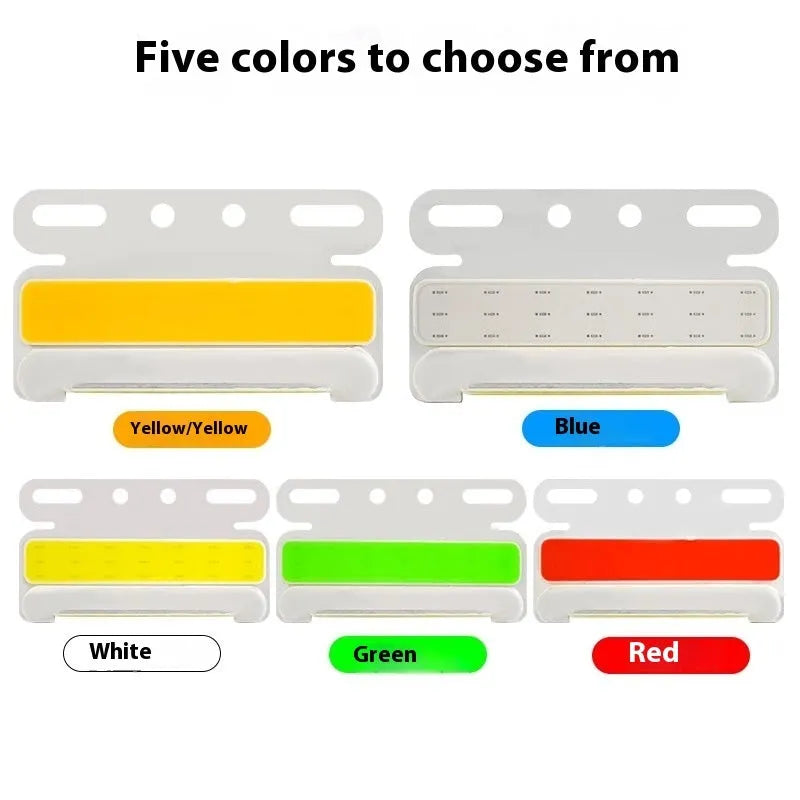 Waterproof aluminium alloy COB LED ground tyre light for trucks in 12v or 24v, shown in available colours.
