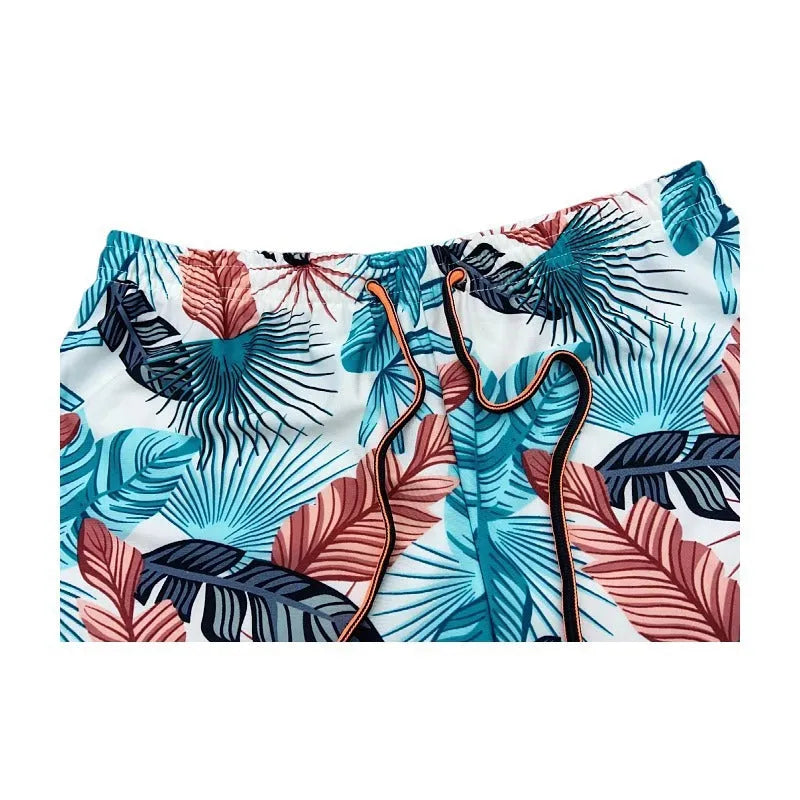Men's blue leaf pattern cropped swimming trunks with polyester spandex fabric