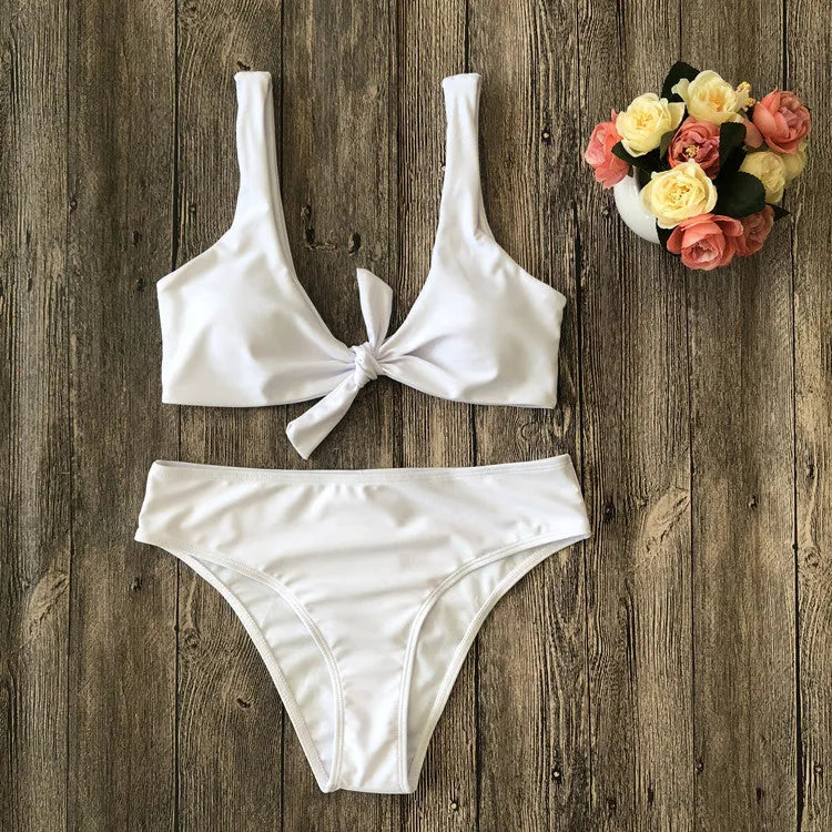 Women's solid colour bikini set with bra top and briefs in black, pink, red, white, or wine red.