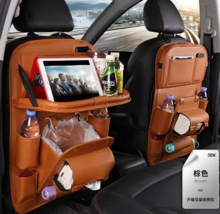 PU leather car seat back organiser bag with zipped main pocket and mesh side holders.