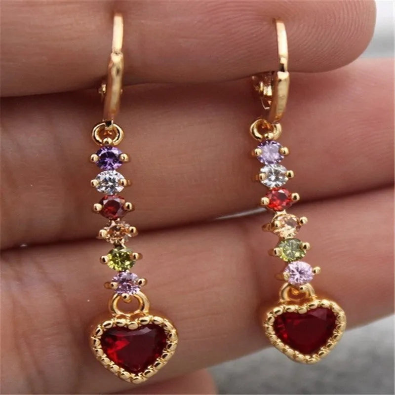 Pair of women's heart-shaped alloy earrings with electroplated gold or silver finish.