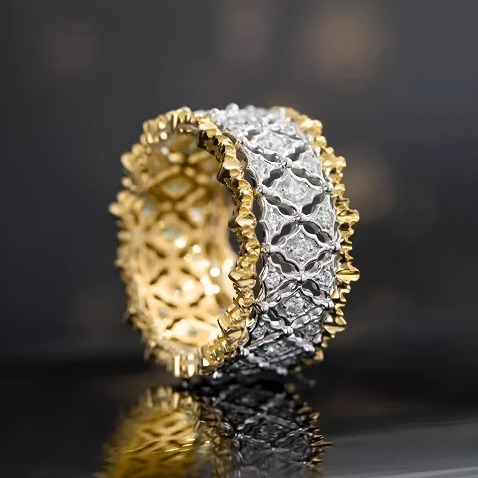 Geometric round two-tone zircon ring on a copper band, showing electroplated finish.