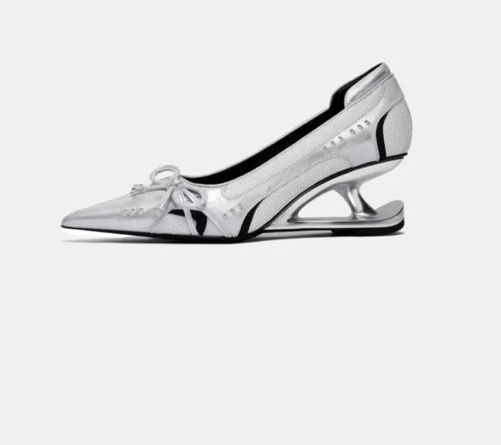 Black women's pointed toe Mary Jane shoes with a distinctive floating shaped heel and slip-on strap.