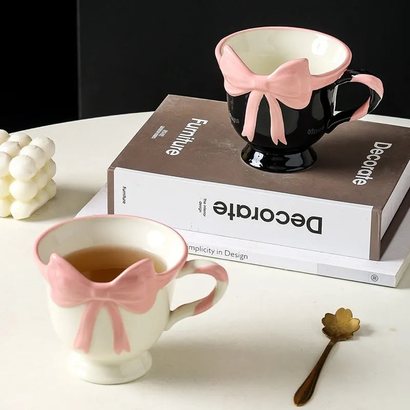 White ceramic mug with heart and bow design, 301-400ml capacity, bow-shaped handle