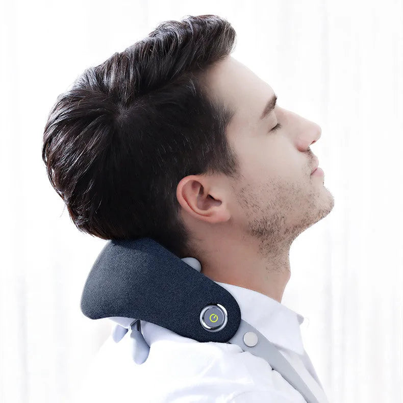 Rechargeable neck massager in dark blue with imitation hand grip and heat function on a home surface