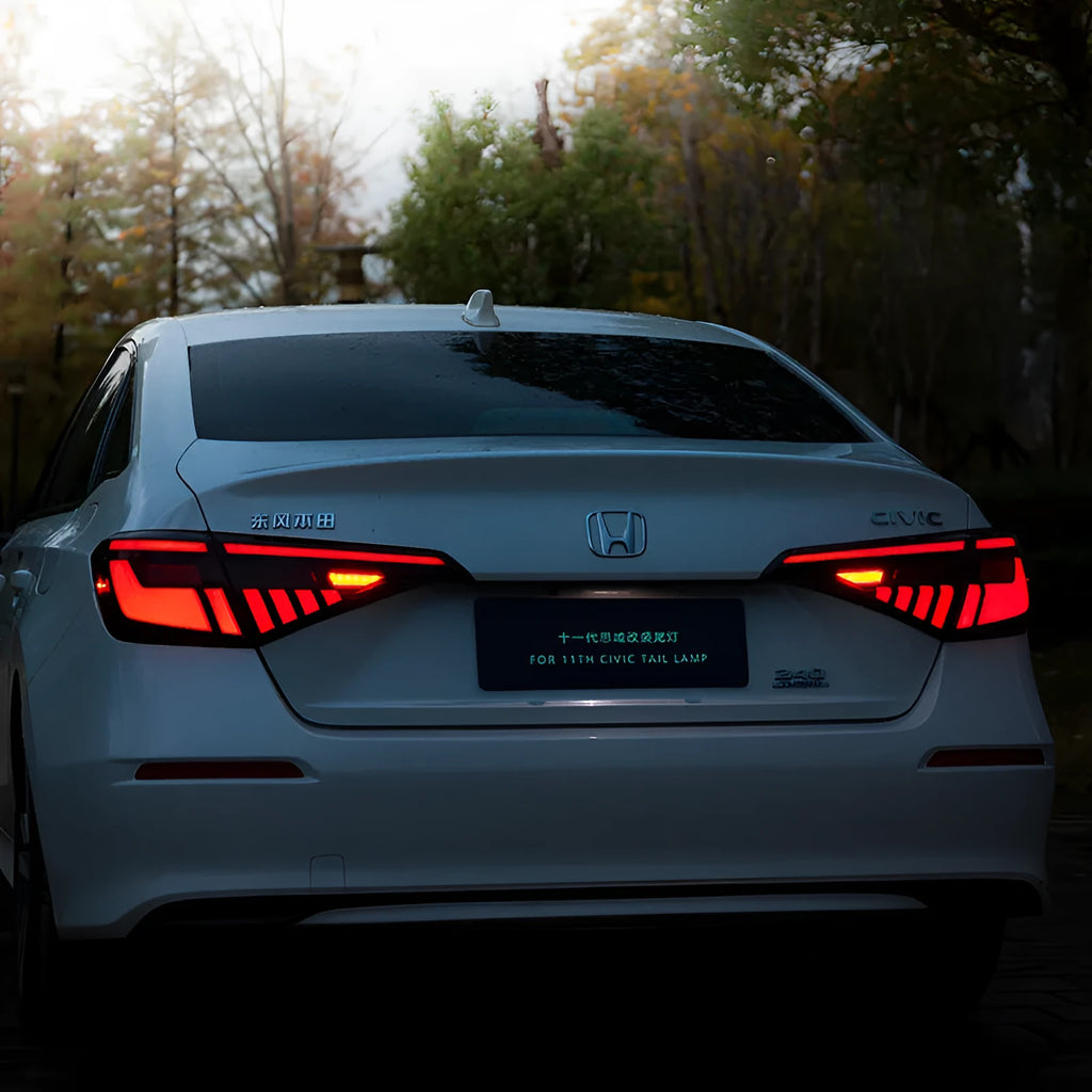 11th Generation Honda Civic modified LED taillight assembly with sequential streamer turn signals in black and red finish.