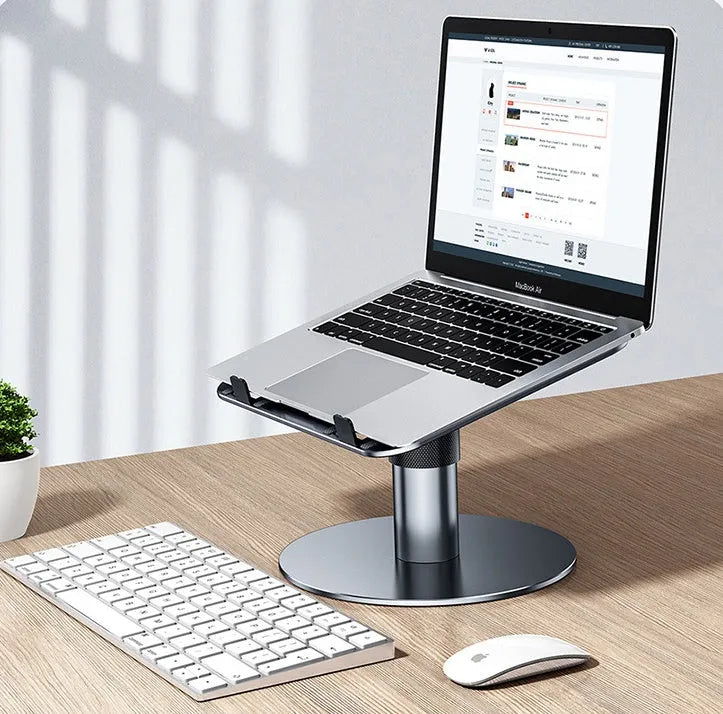 Silver aluminium laptop stand at adjustable height with rotating base and non-slip pads