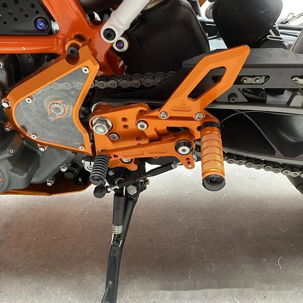 KTM DUKE motorcycle rear shift pedal support assembly modification kit in black and orange