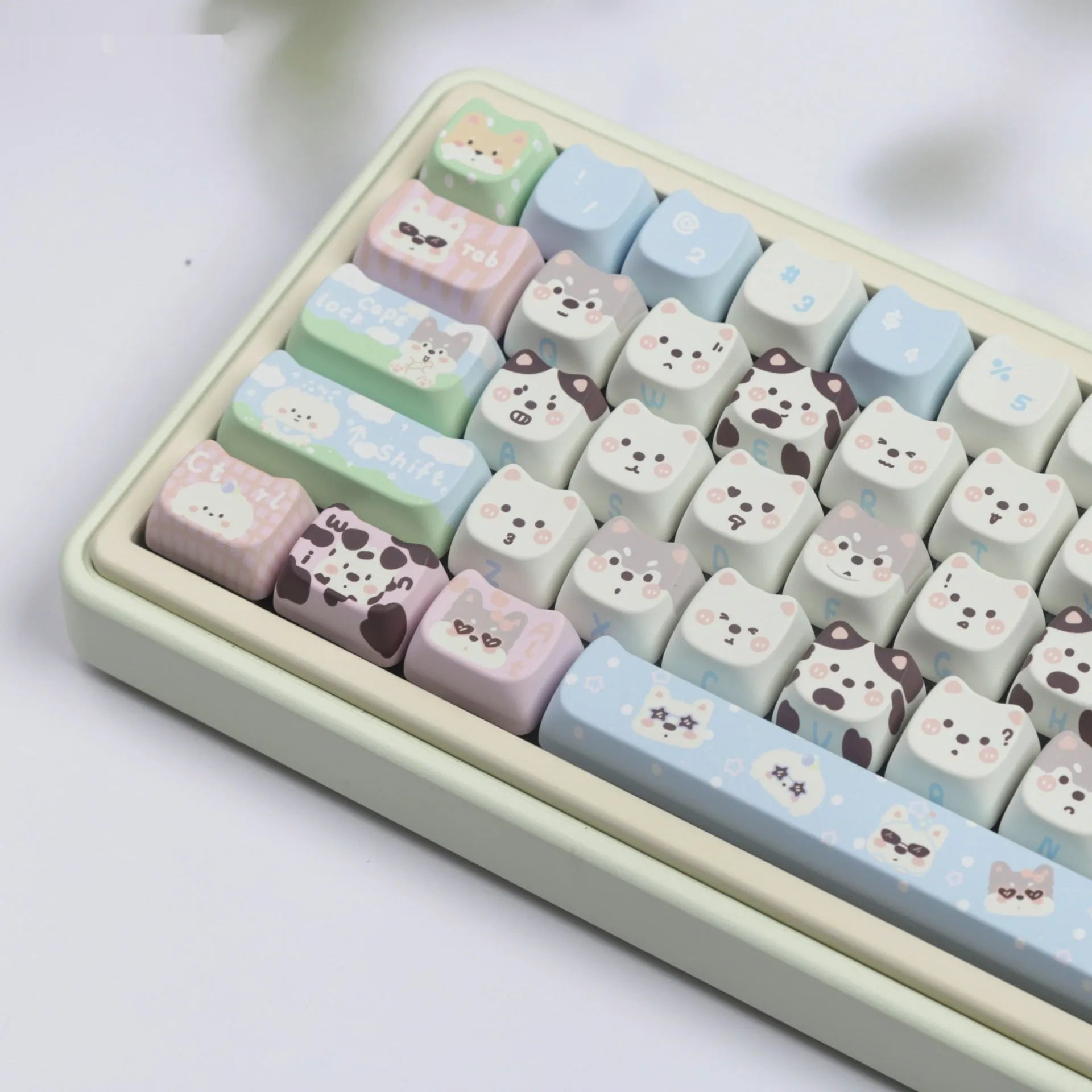 Full set of colourful PBT keyboard keycaps with sublimated cute puppy and cat designs laid out.