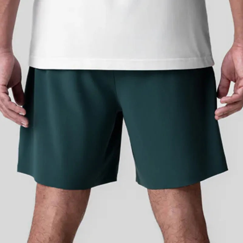 Men's grey seamless sports shorts with quick-drying fabric and straight knee-length cut