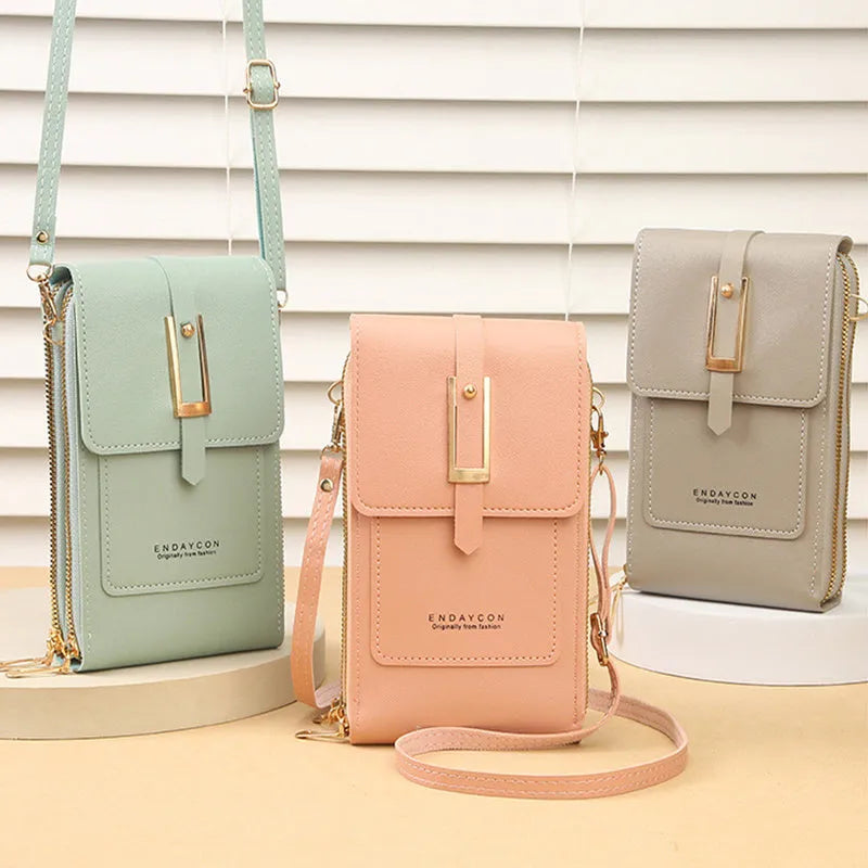 Women's transparent crossbody shoulder bag in PU material with touch screen phone capability, available in multiple colours