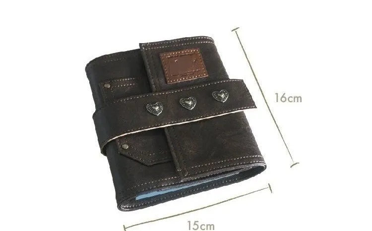 Brown A7 retro notebook with buckle closure showing loose-leaf binding and raw wood pulp paper
