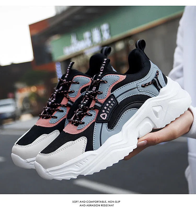 Women's thick-soled casual sports shoes with mesh upper and buckle detailing in black colour