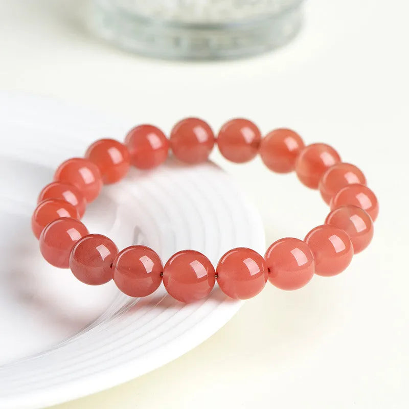 Natural cherry red agate bracelet with polished scattered beads, shown in a single circle style.