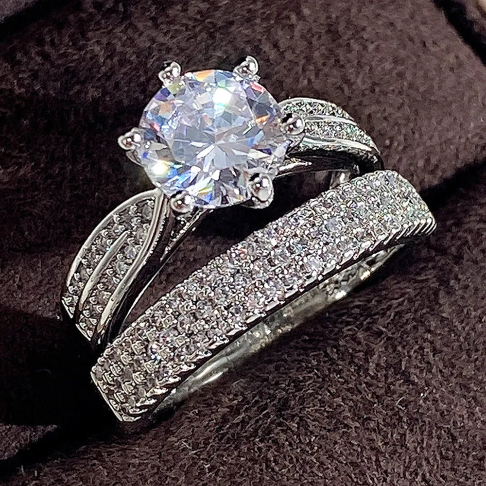 White gold colour alloy geometric wedding ring bracelet on a size chart.