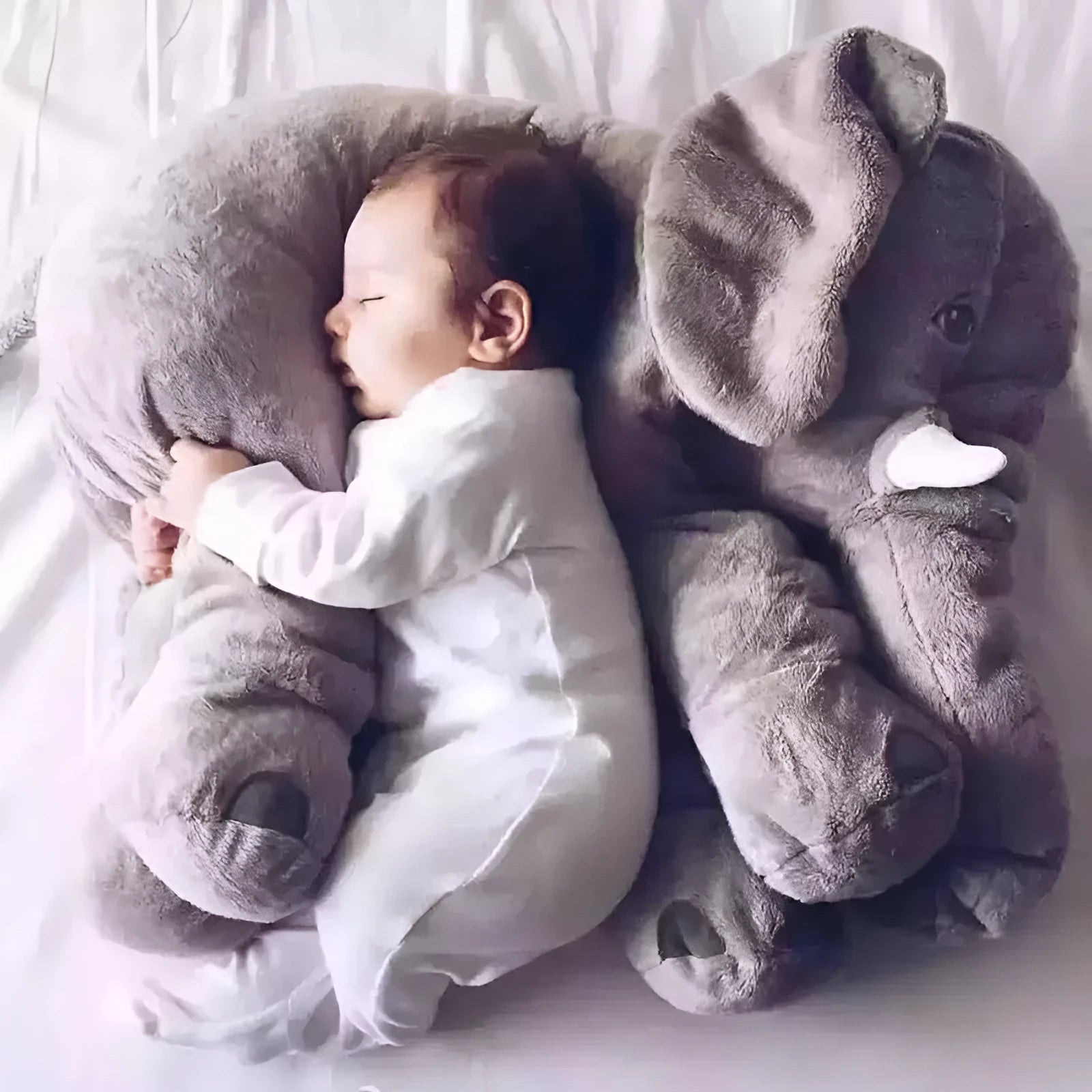 Soft grey elephant plush pillow shell for a child's bed, showing short plush texture.