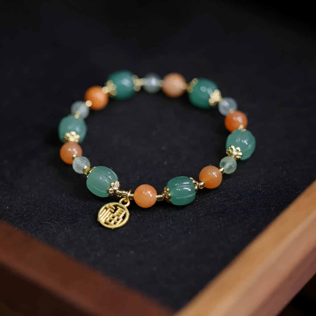 Women's Chinese style Duobao pumpkin bracelet made of Jinsi Jade and Prehnite beads.