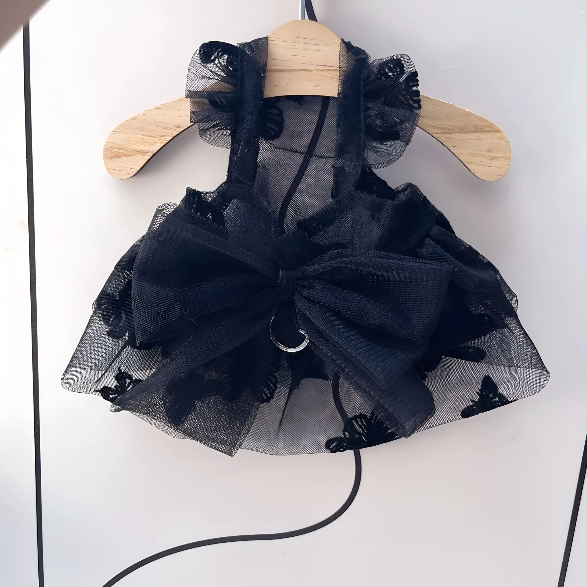 Black gauze princess tulle skirt for a small dog or cat on a mannequin.