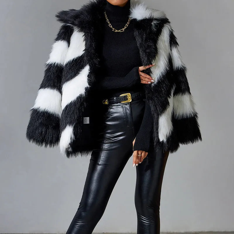 Women's faux fur coat with contrast colour lapel and a matching fur collar.