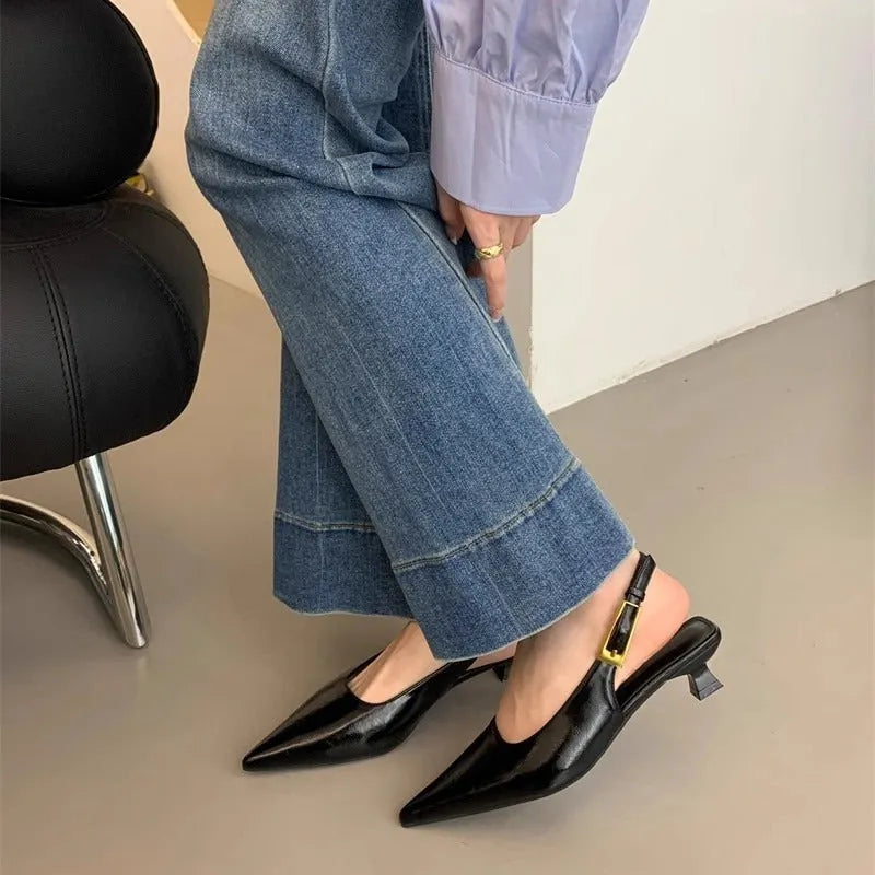 Women's black leather low heel strap shoes with pointed toe and thin rubber soles