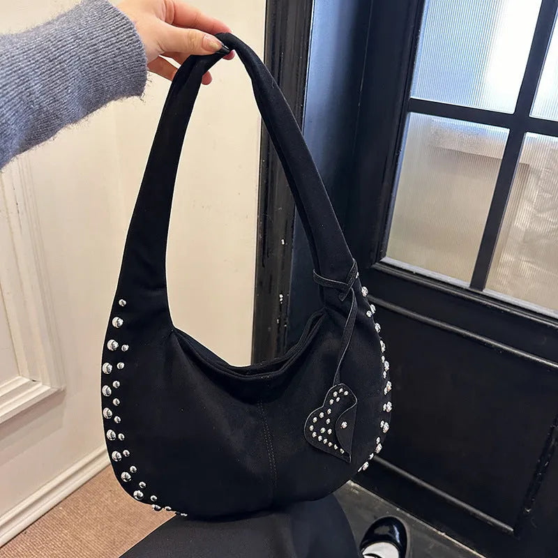 Soft plush retro tote handbag shown in black colour with strapless underarm carry design