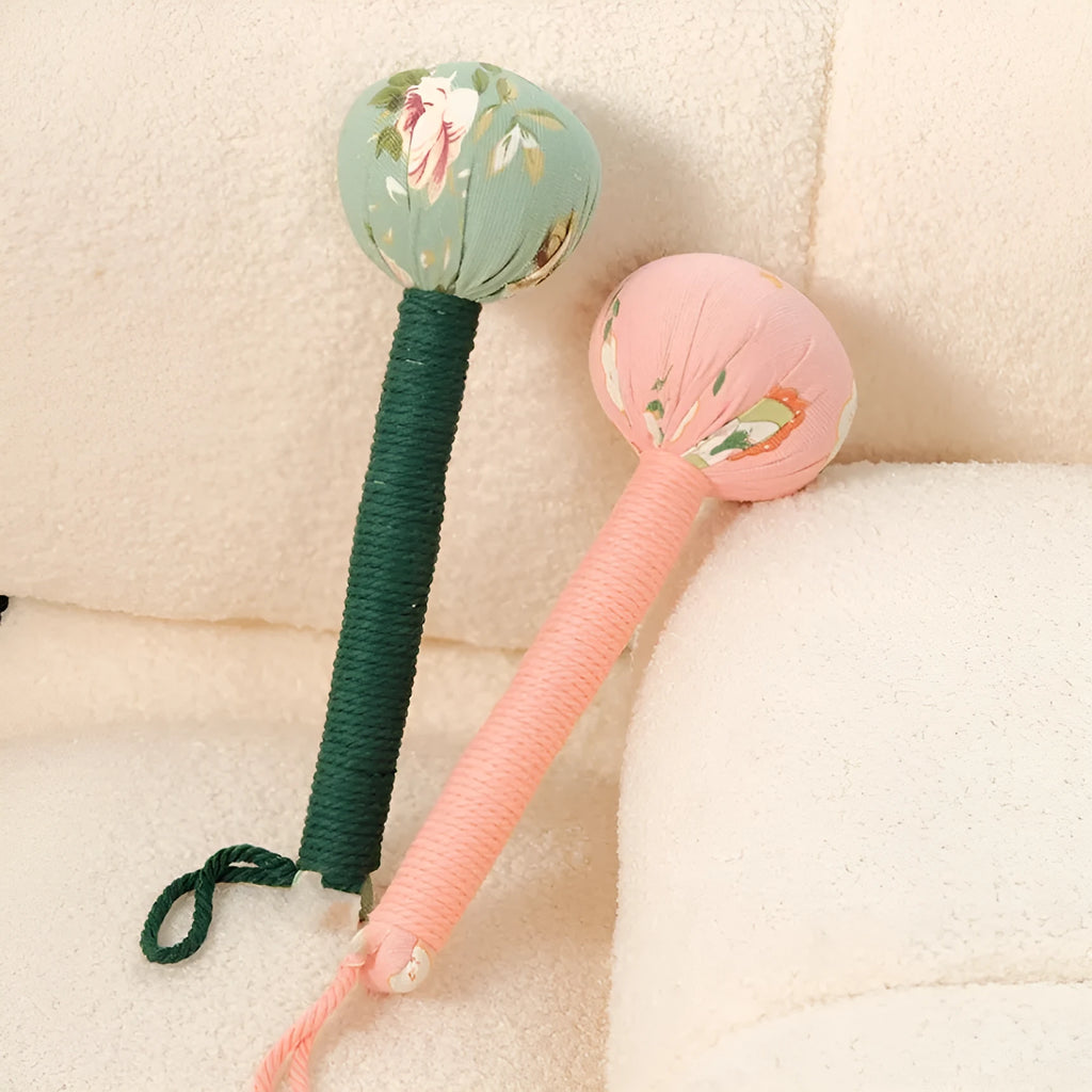 Argy wormwood hand-held massage hammer in green, shown alongside pink, purple, red and yellow colour options.