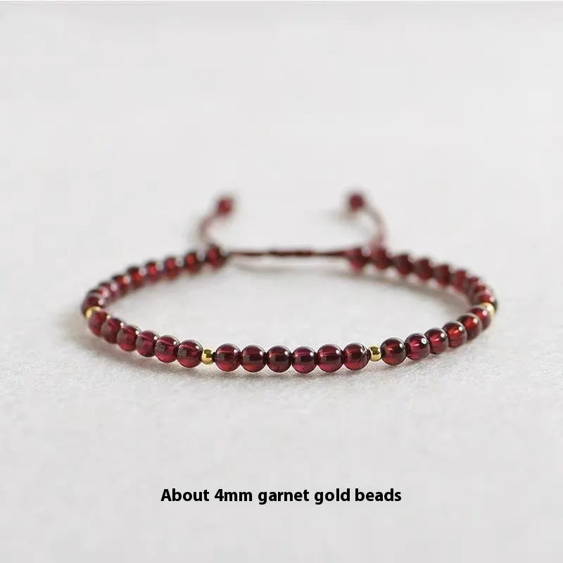 Hand-woven garnet Chinese bracelet with red rope design on flexible wire
