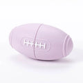 Coloured silicone rugby ball dog chew toy with treat-dispensing holes in blue, pink, purple options