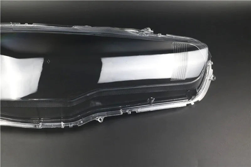 Transparent plastic car headlight housing cover showing 50mm by 30mm dimensions