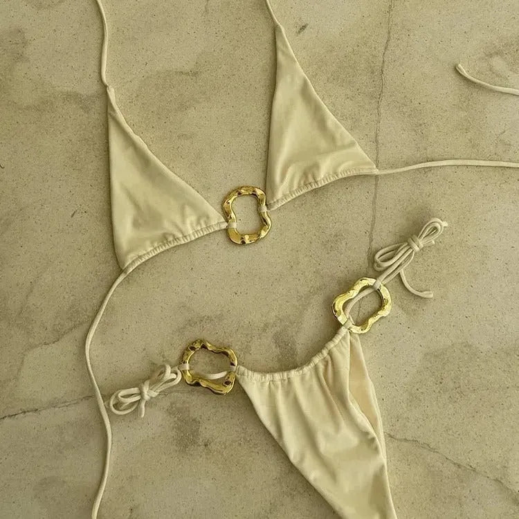 Women's solid colour halter bikini with lace-up front and low-waist briefs.