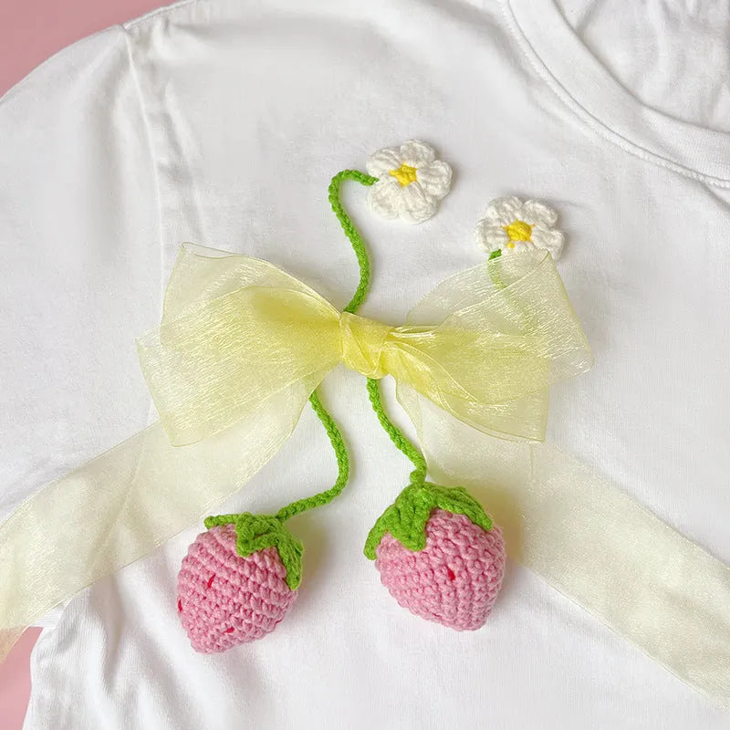 Wool crochet woven strawberry pendant necklace showing knitted texture and single charm design