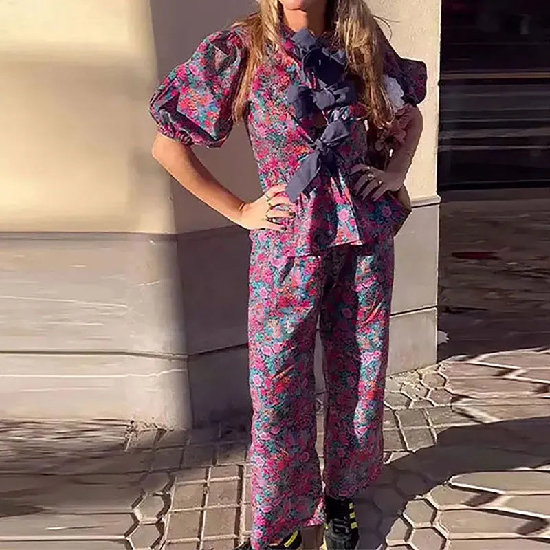 Women's floral printed trousers suit set with tie-neck puff sleeve top and matching trousers