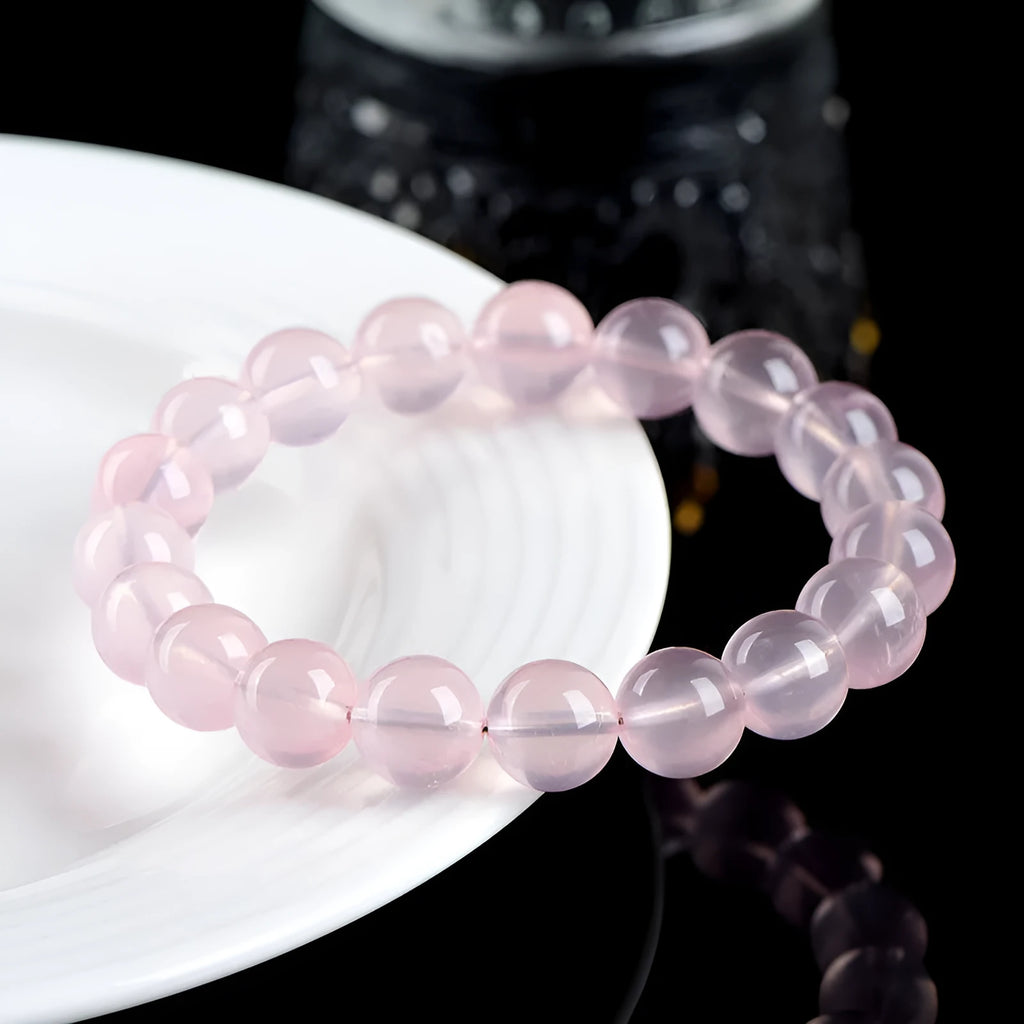Crystal bracelet with polished pink round beads in natural starlight design showing single circle construction