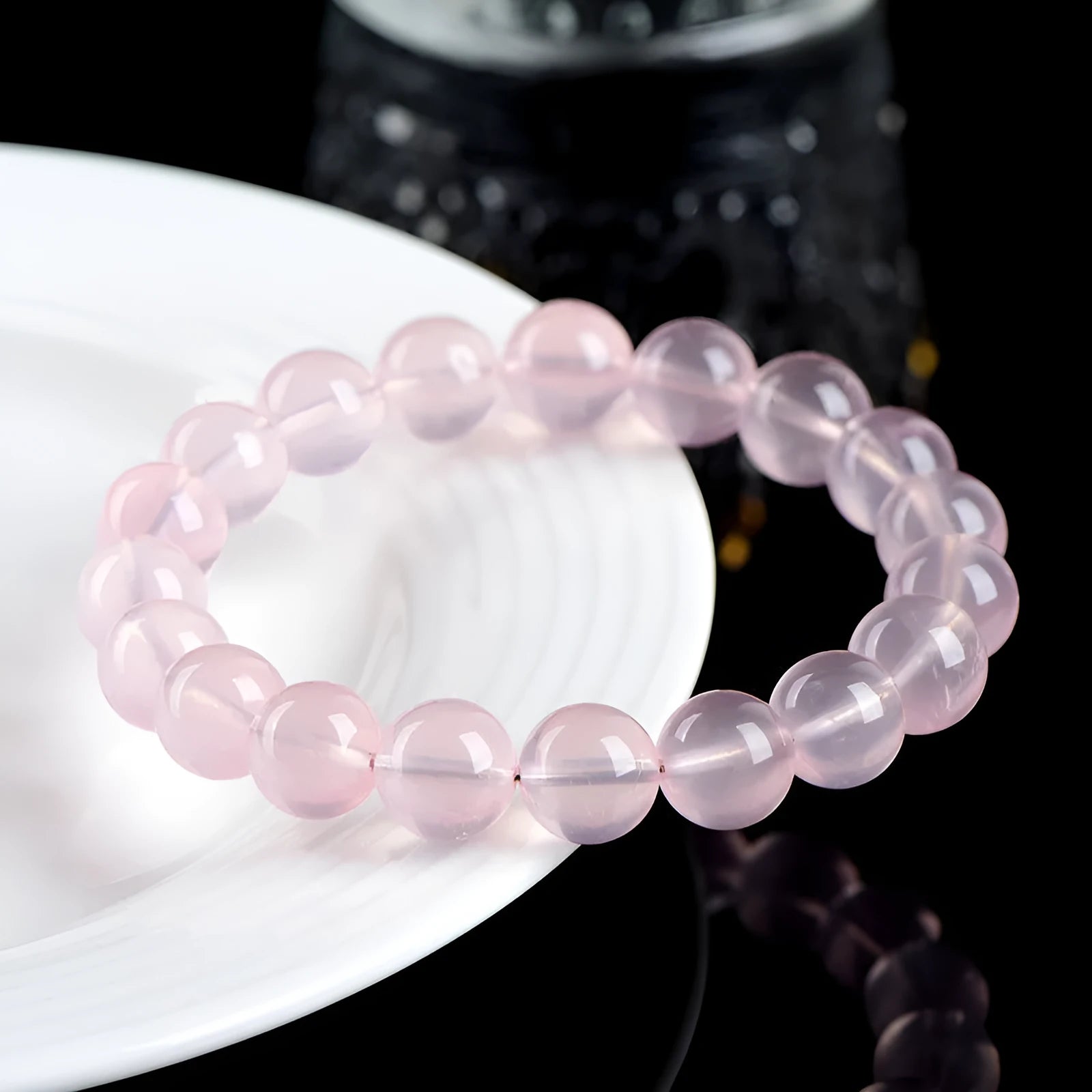 Crystal bracelet with polished pink round beads in natural starlight design showing single circle construction