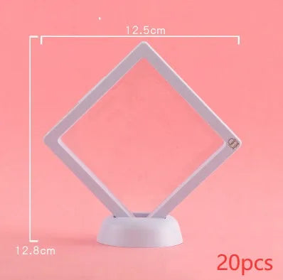 3D floating display case holding coins and jewellery between transparent membrane sheets