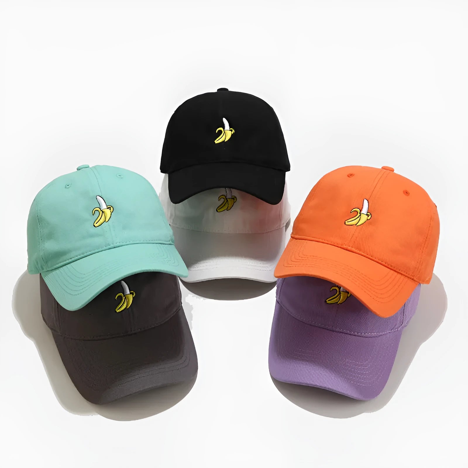 Adjustable black baseball cap with white banana embroidery on the front.