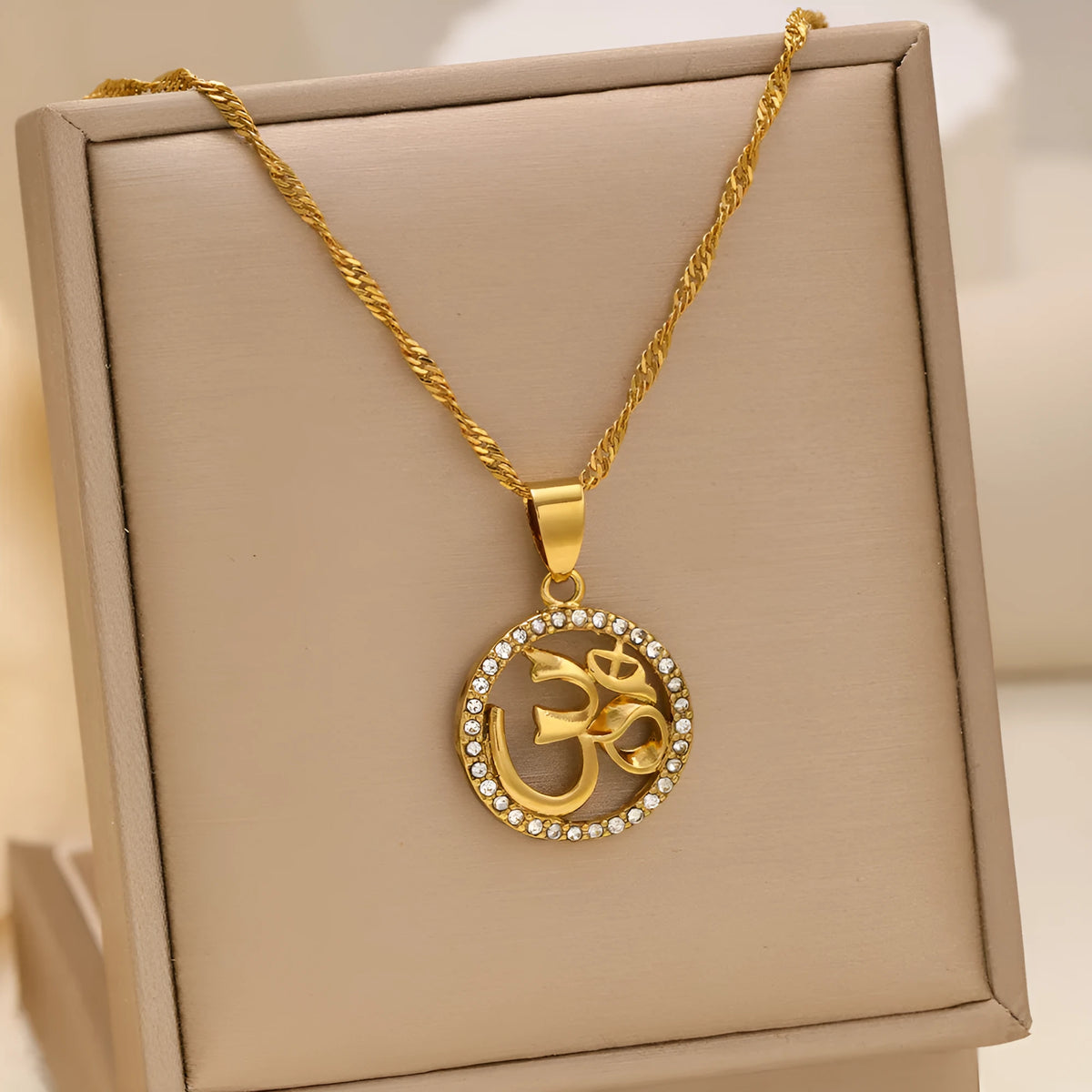 Gold plated copper necklace with circular OM pendant and inlaid stones