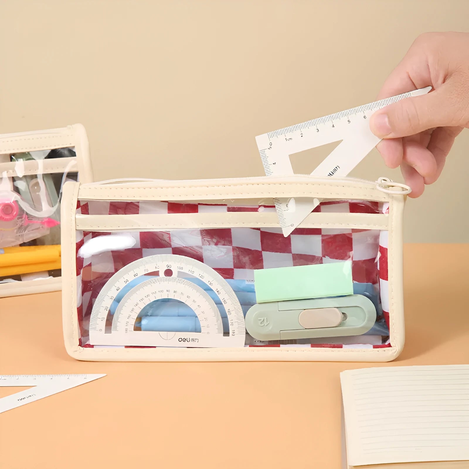 Large transparent PVC pencil case with chessboard grid pattern in black and white plaid.