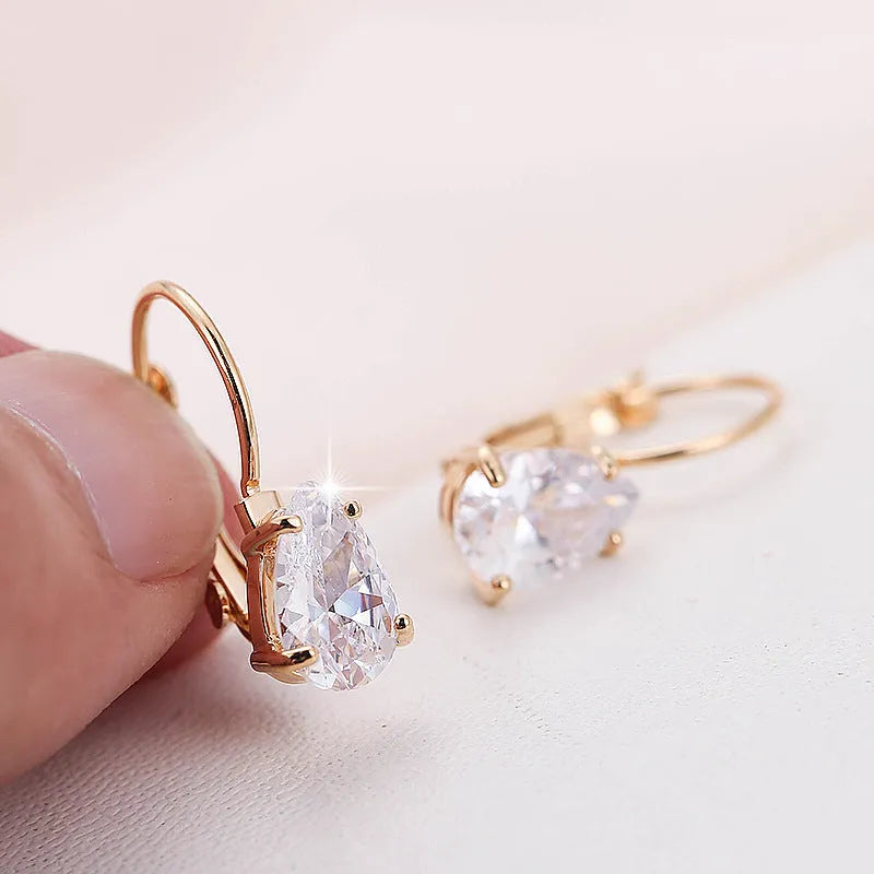 Pair of drop-shaped fashion earrings with gem inlay in gold or platinum plating