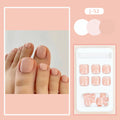 Finished plastic toe nail stickers in J-52 skin colour with glue tube on white background.