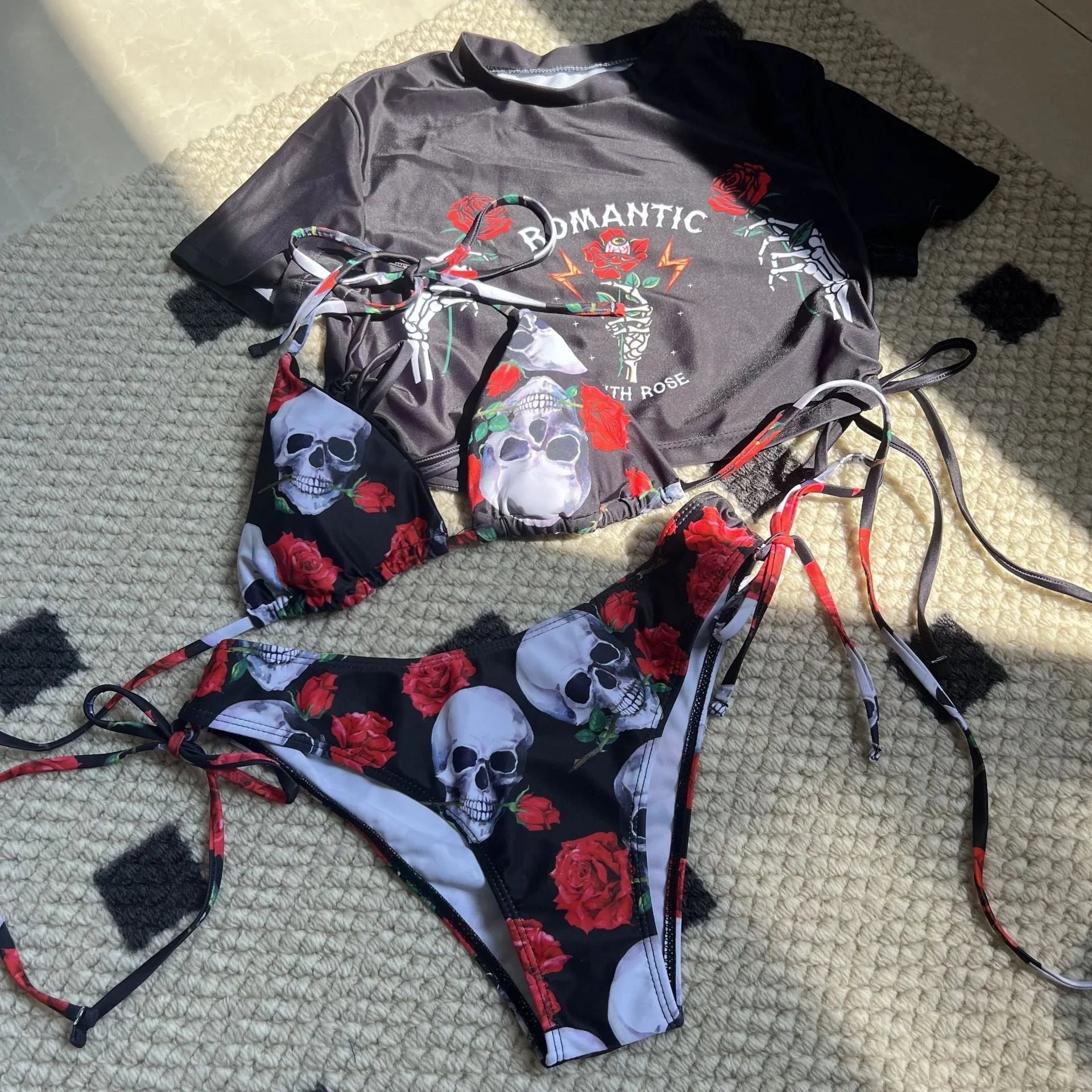 Women's three-piece swimsuit set with skull and rose printed design in red colour