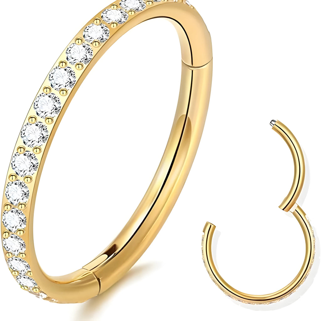 A round stainless steel seamless nose ring on a grey background, shown in a gold plated finish.