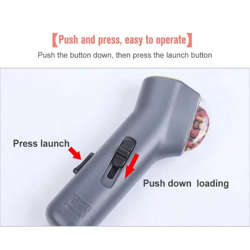 Grey plastic dog treat catapult launcher toy with spring trigger mechanism