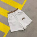 Man wearing grey patchwork double waist loose hip hop trousers for casual sports wear.