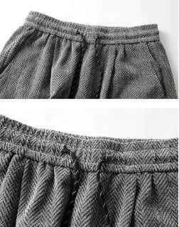 Plus-size fleece-lined straight-leg trousers in light grey on a hanger