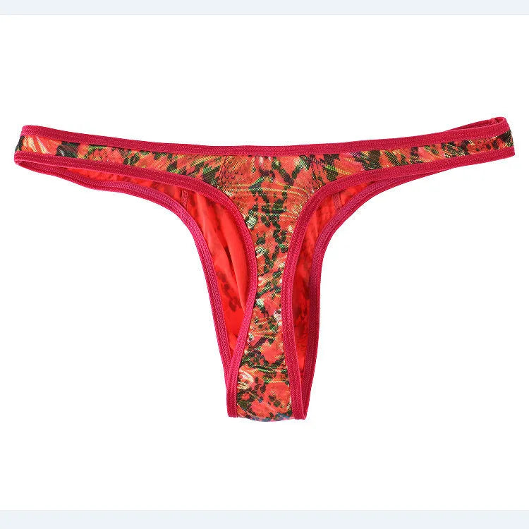 Men's green camouflage snake print thong underwear on a solid background.