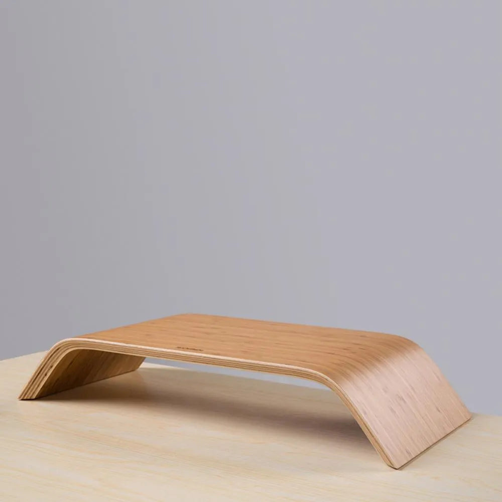 Walnut laptop stand with stability bracket in bamboo leather colour on a desk