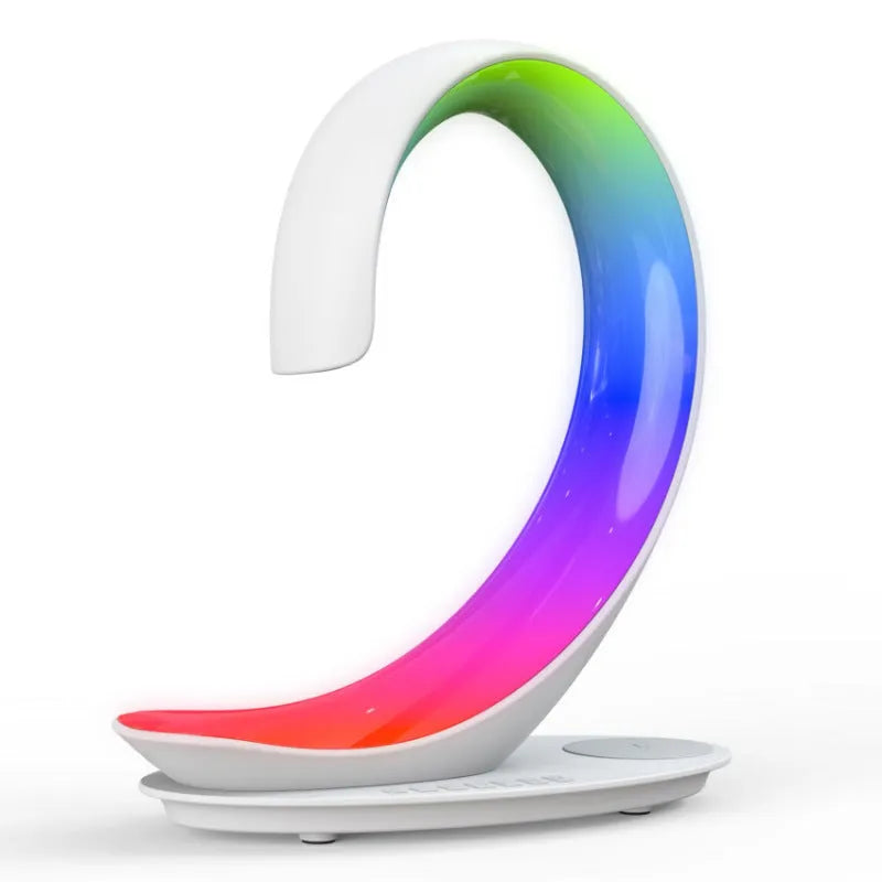 White swan decorative desk lamp with colourful RGB lighting, Bluetooth speaker, and wireless charging pad