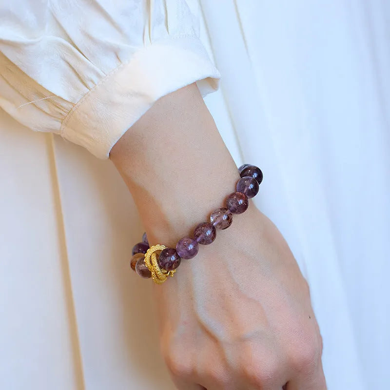 Purple crystal bracelet with 10mm beads featuring Nine Purple Good Luck design and animal zodiac motifs