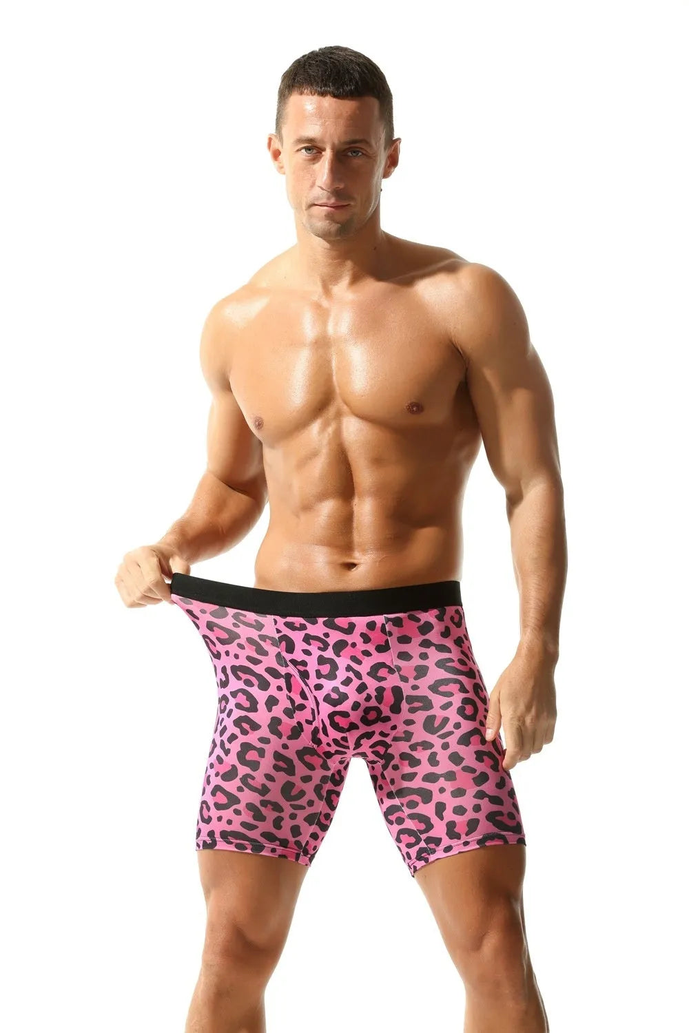 Men's wild leopard print underwear in pink, black and green tie-dye, and doughnut colours on a white background.